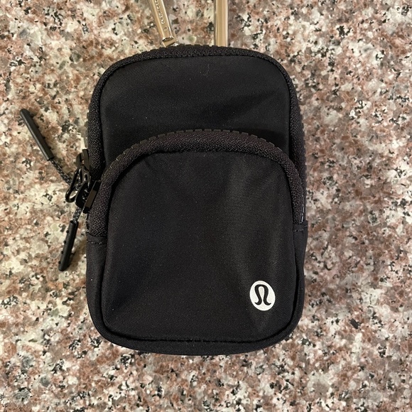 lululemon athletica Handbags - Lululemon Nano Clip-on Backpack   New without tags NWOT   Black  with silver
